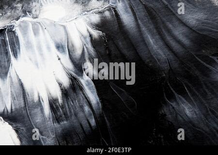 Abstract black and white watercolor or acrylic paint background. Black and white paint splash texture can be used for any design. Stock Photo