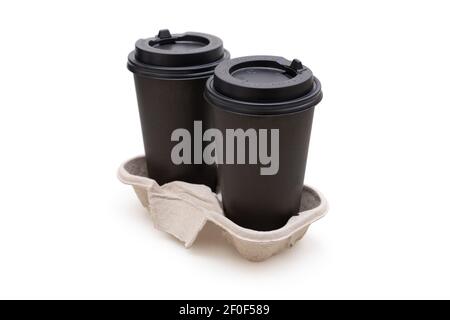 Two brown paper coffee cups in the holder isolated on white Stock Photo
