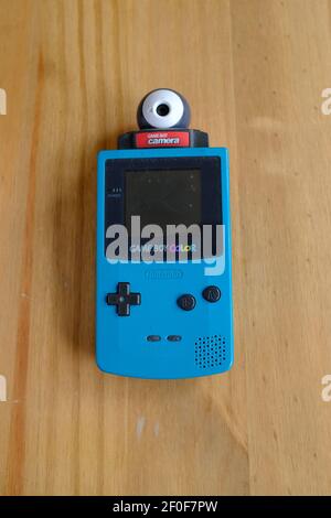 LONDON - 6TH MARCH 2021: The 1998 Nintendo Gameboy color with the Game Boy Camera cartridge. Stock Photo