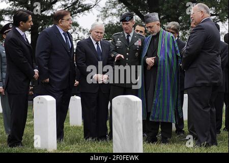 13 May 2010 - Arlington, Virginia - (left to right) Afghan Minister of Defense Abdul Rahim Wardak, Defense Secretary Robert M. Gates and Aghan President Hamid Karzai listen to the Commander, International Security Assistance Force (ISAF) and Commander, U.S. Forces Afghanistan Army General Stanley McChrystal at a grave site while on a tour of Section 60 in Arlington National Cemetery and in Arlington, VA. Photo Credit: Jerry Morrison/DOD/Sipa Press (RELEASED)/1005132102