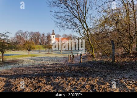 Duisburg - View to the village church which is the oldest church in Friemersheim and evangelical since 1560, protected by the dike, North Rhine Westph Stock Photo