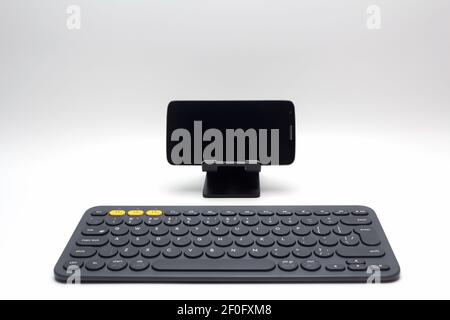 Mobile phone and wireless keyboard Stock Photo