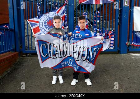 Rangers fans wearing Steven Gerrard masks hold up a banner outside of the Ibrox Stadium, home of Rangers FC. Picture date: Sunday March 7, 2021. Stock Photo