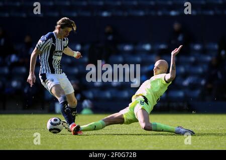Newcastle United's Jonjo Shelvey tackles West Bromwich Albion's Conor Gallagher during the Premier League match at The Hawthorns, West Bromwich. Picture date: Sunday March 7, 2021. Stock Photo