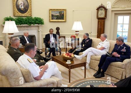 21 June 2010 - Washington, D.C. - President Barack Obama meets with Defense Secretary Robert Gates and the Joint Chiefs of Staff in the Oval Office, June 21, 2010. Pictured, clockwise from the President, are Army Chief of Staff Gen. George W. Casey, Jr., Chief of Naval Operations Admiral Gary Roughhead, Chief of Staff of the Air Force Gen. Norton S. Schwartz, Chairman of the Joint Chiefs of Staff Admiral Michael Mullen, Commandant of the Marine Corps Gen. James T. Conway, and Gen. James Cartwright, vice chairman of the Joint Chiefs of Staff. Photo Credit: Pete Souza / White House/Sipa Press Th