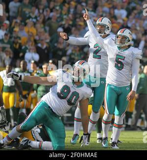 Green Bay Packers holder B.J. Sander watches as kicker Ryan Longwell (8)  kicks the game-winning field goal in overtime against the Detroit Lions on  Sunday, Dec. 11, 2005, in Green Bay, Wis.