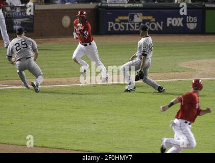 Texas Rangers Mark Teixeira runs out of the batters box after hitting a  double off of Cleveland Indians pitcher Cliff Lee that scored Alfonso  Soriano and Michael Young in the third inning