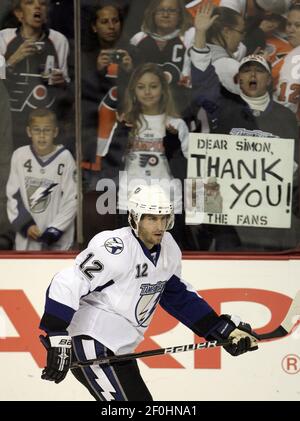 Former Tampa Bay Lightning center Vincent Lecavalier with his wife  Caroline, and his children Amelia, Gabriet, and Victoria, during his jersey  retirement ceremony before an NHL hockey game against the Los Angeles