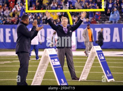 Former New York Giants Phil Simms waves to fans as he is inducted into the  Giants Ring of Honor at New Meadowlands Stadium in East Rutherford, New  Jersey, Sunday, October 3, 2010. (