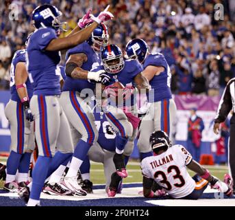 New York Giants' Ahmad Bradshaw flexes after scoring a second-quarter  touchdown against the Pittsburgh Steelers at The New Meadowlands Stadium in  East Rutherford, New Jersey, on Saturday, August 21, 2010. (Photo by