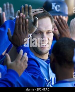 Kansas City Royals' third baseman Alex Gordon makes the throw to first  base for the final out in the eighth inning in the team's first  intrasquad game of spring training in Surprise