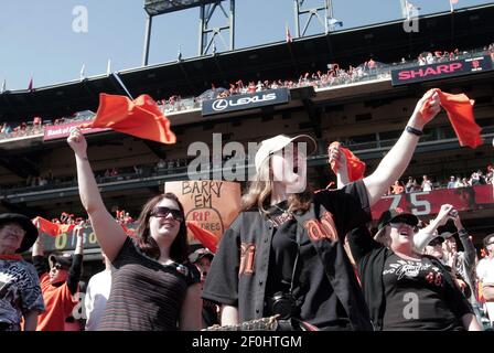 Former Arizona Diamondbacks players Luis Gonzalez, right, and Randy  Johnson, wave to fans during the teams' 25th anniversary ceremony prior to  a baseball game against the San Diego Padres', Saturday, Aug. 12