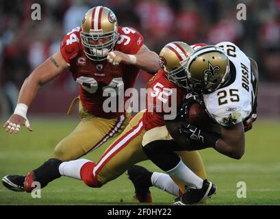 San Francisco 49ers Patrick Willis (52) tackles New Orleans Saints Reggie  Bush (25) in the second quarter on Monday, September 20, 2010 at  Candlestick Park in San Francisco, California. (Photo by Jose