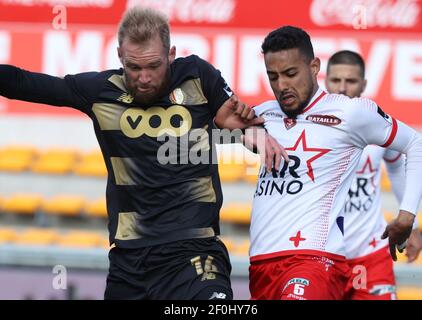 Mouscron's Saad Agouzoul and Standard's Joao Klauss De Mello fight for the ball during a soccer match between Royal Excel Mouscron and Standard Liege, Stock Photo