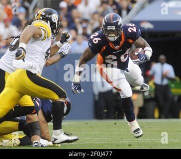 Denver Broncos head coach Josh McDaniels (R) congratulates running back  LenDale White (26) after his two-yard touchdown run against the Pittsburgh  Steelers during the first quarter at Invesco Field at Mile High