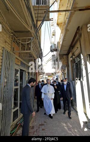 Najaf, Iraq. 07th Mar, 2021. Pope Francis walks to meet Ayatollah Ali Al Sistani, Iraq's most revered Shiite cleric, in Najaf, Iraq, on March 6, 2021, on the second day of the first papal visit to Iraq. Photo by Balkis Press/ABACAPRESS.COM Credit: Abaca Press/Alamy Live News Stock Photo