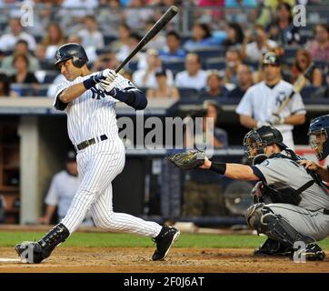 Kansas City Royals' Alex Gordon (4) makes an error on a ball hit by  New York Yankees' Derek Jeter (2) in the first inning, Tuesday,  September 29, 2009, at Yankee Stadium in