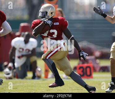 San Francisco 49ers rookie RB Anthony Dixon (33) high steps over a