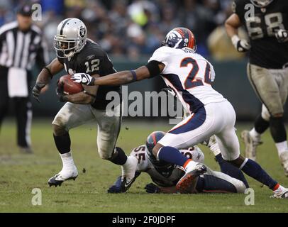 Oakland, California, USA. 6th Dec, 2012. Denver Broncos cornerback Champ  Bailey (24) celebrates interception on Thursday at O.co Coliseum in  Oakland, CA. The Broncos defeated the Raiders 26-13. Credit: Al Golub/ZUMA  Wire/Alamy