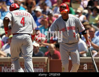 Cincinnati Reds' Todd Frazier, left, is congratulated by teammate Brandon  Phillips after hitting a solo home run during the sixth inning of a baseball  game against the St. Louis Cardinals, Friday, Sept.