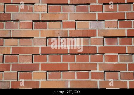 Closeup of isolated new red brick wall blocks Stock Photo