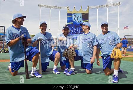 Comedian Paul Rudd, left, put on a Kansas City Royals shirt and