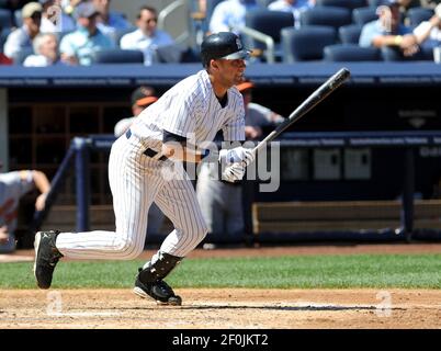 Kansas City Royals' Alex Gordon (4) makes an error on a ball hit by  New York Yankees' Derek Jeter (2) in the first inning, Tuesday,  September 29, 2009, at Yankee Stadium in