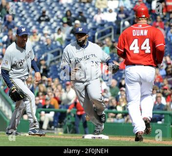 Adam Dunn of the Washington Nationals looks at his son Brady Dunn