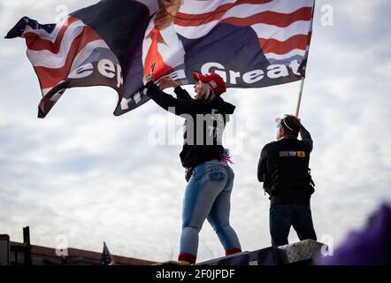 Trump supporters along with the far-right extremist group the Proud Boys take part in the 'Stop the Steal' rally on December 12, 2020 in DC. Stock Photo