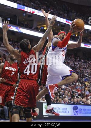 Miami Heat's Udonis Haslem (40) fights for a rebound against the  Phoenix Suns' Jason Richardson (23) during the second quarter of NBA  action at American Airlines Arena in Miami, Florida, on Wednesday