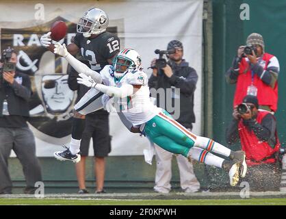 Cincinnati Bengals wide receiver Jordan Shipley (11) is tackled by Miami  Dolphins cornerback Benny Sapp in