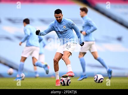 Manchester City's Riyad Mahrez warming up before the Premier League match at the Etihad Stadium, Manchester. Picture date: Sunday March 7, 2021. Stock Photo