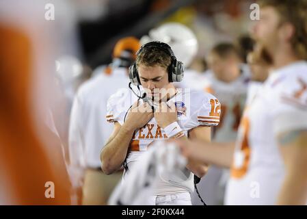 Injured Texas quarterback Colt McCoy talks to former Texas