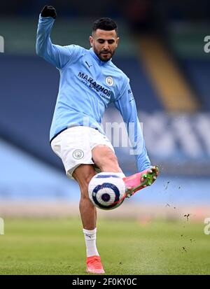 Manchester City's Riyad Mahrez warming up before the Premier League match at the Etihad Stadium, Manchester. Picture date: Sunday March 7, 2021. Stock Photo