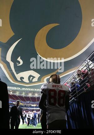 Former St. Louis Rams Isaac Bruce holds the Super Bowl trophy during  ceremonies celebrating the teams Super Bowl victory in the 1999-2000  season, at the Edward Jones Dome during half time of