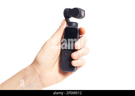 Hand hold action camera isolated on white background. Stock Photo