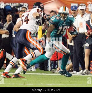 Miami Dolphins wide receiver Brandon Marshall (19) runs the ball during  first half action, between the Miami Dolphins, and the New York Jets  January 1, 2012 at Sun Life Stadium in Miami