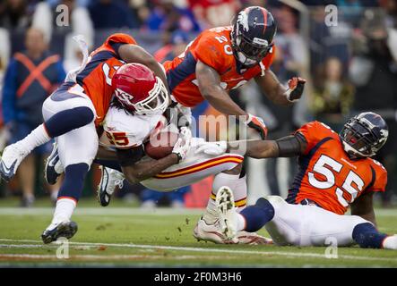 New York Jets running back LaDainian Tomlinson (21) celebrates his game-winning  two-yard touchdown run with Denver Broncos cornerback Nate Jones watching  in the fourth quarter at Invesco Field at Mile High on