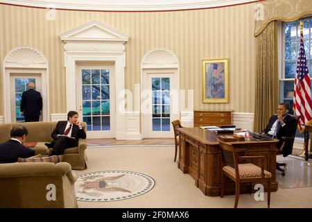 United States President Barack Obama talks on the phone while Vice President Joe Biden, his National Security Advisor Anthony Blinken, and Puneet Talwar, Senior Director for Iraq, Iran and the Gulf States wait nearby in the Oval Office, November 4, 2010. .Mandatory Credit: Pete Souza - White House via CNP/Sipa USA