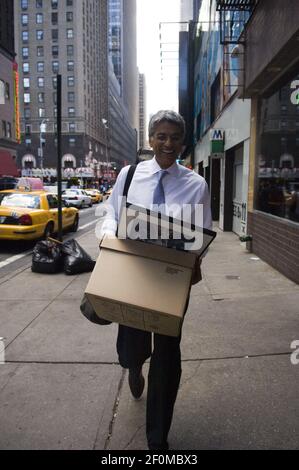 An employee of Lehman Brothers Holdings Inc. carries a box out of the  Lehman Brothers Global headquarters in New York on Monday, September 15,  2008. Lehman filed for bankruptcy protection and is