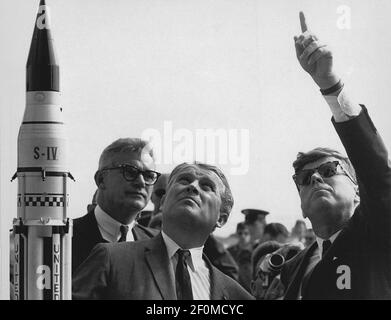 Marshall Space Flight Center (MSFC) Director, Doctor Wernher von Braun explains the Saturn Launch System to United States President John F. Kennedy at Cape Canaveral, Florida on November 16, 1963. National Aeronautics and Space Administration (NASA) Deputy Administrator Robert Seamans is to the left of von Braun. (Photo by NASA/CNP)*** Please Use Credit from Credit Field ***