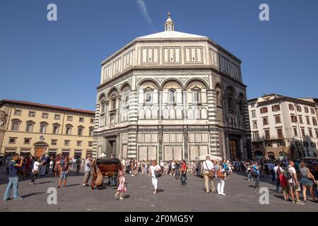 The Baptistery of San Giovanni stands in both the Piazza del Duomo and the Piazza San Giovanni in Florence city, Italy Stock Photo