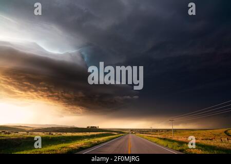 Dramatic storm clouds as a supercell thunderstorm approaches at sunset in Crawford, Nebraska Stock Photo