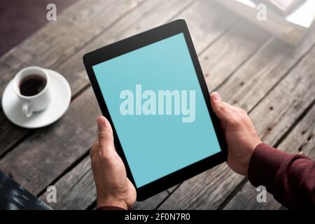 Digital tablet in male hands Stock Photo