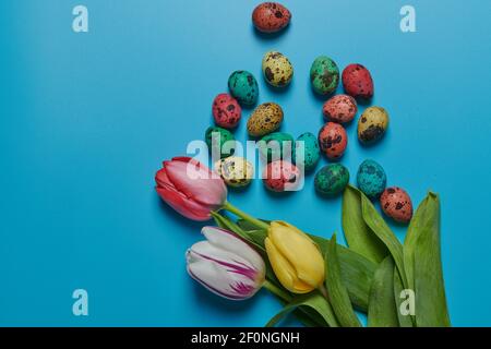 colored flowers tulips and painted eggs for easter Stock Photo
