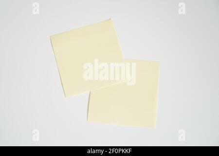 two yellow blank sticky notes Stock Photo