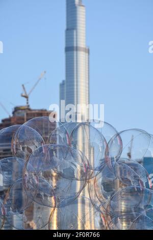 Close up of transparent balloons and blurred Burj Khalifa in the background Stock Photo