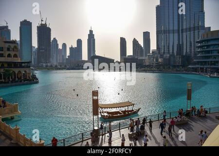 A crowd of tourists near Dubai mall fountain in the daytime Stock Photo