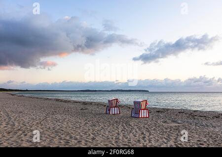Lonely beach chairs in the morning light at the big beach of Thiessow, island Ruegen, Baltic Sea, Mecklenburg-Western Pomerania, East Germany Stock Photo