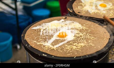 Egg on pancakes with cheese Stock Photo